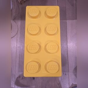 Yellow lego container with Legos